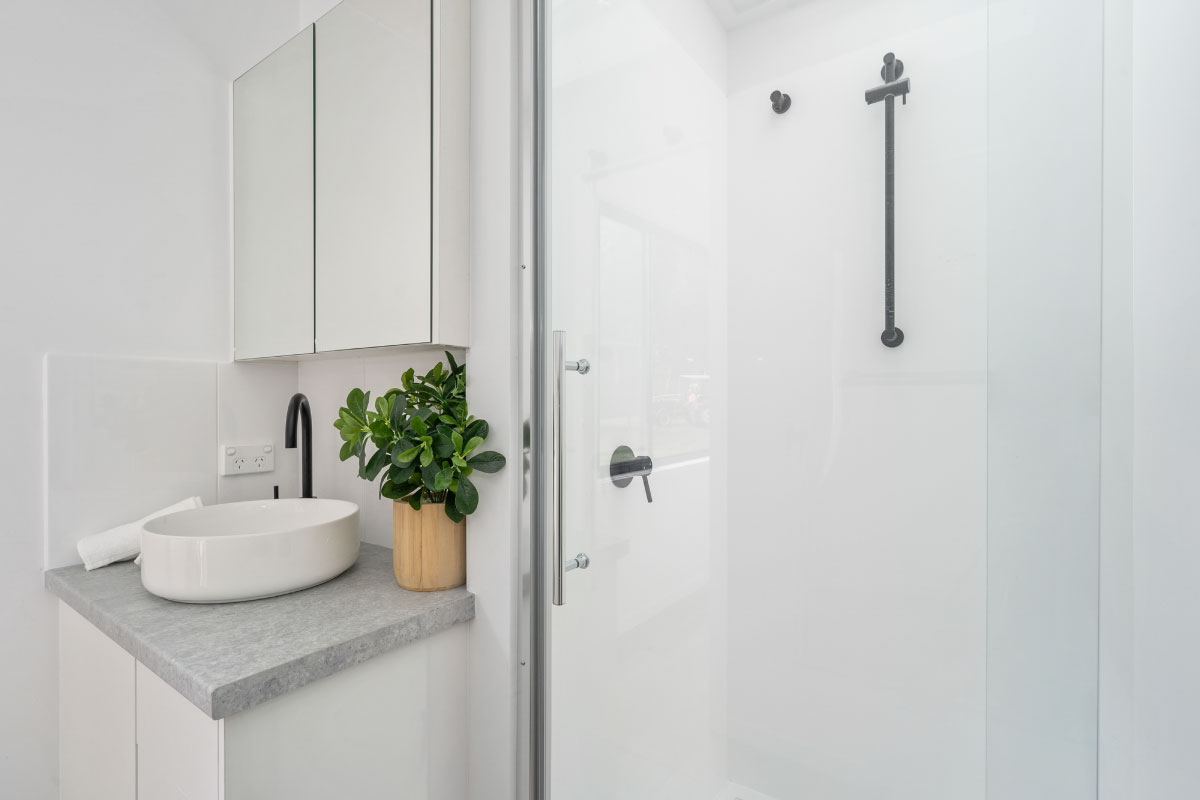 WheelHouse 8.5 tiled shower with semi-frameless pivot door